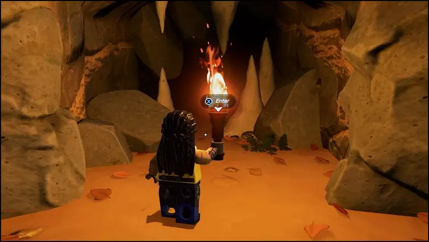 Entrance to a lava cave housing Obsidian ores in Dry Valley biome of LEGO Fortnite.